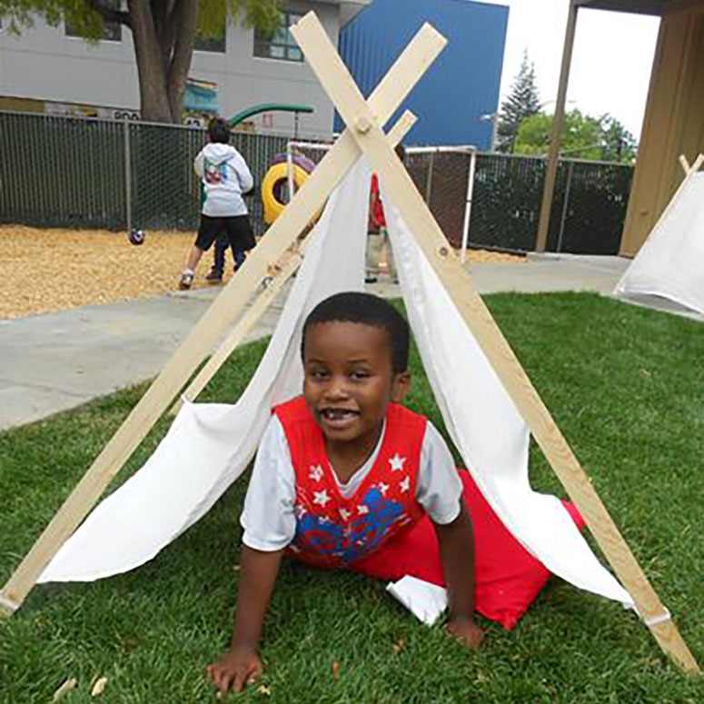 AchieveKids student with arts and crafts project