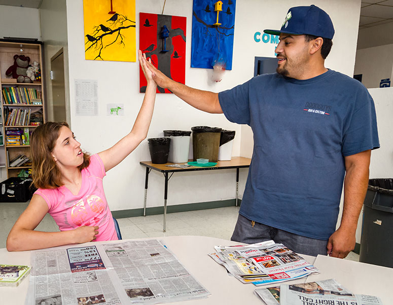 AchieveKids student and volunteer