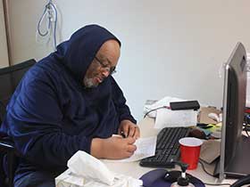 Teacher working at desk photo